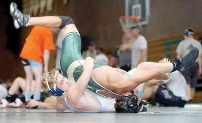 Photos by Daniel Freel/New Jersey Herald — Sparta’s Ian Burke, bottom, struggles with St. Joseph of Montvale’s Christopher Ambrigio during their bout Tuesday evening at the 18th annual North Jersey Summer Duals at Hopatcong High School.
