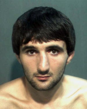 In this May 4, 2013 police mug provided by the Orange County Corrections Department in Orlando, Fla., shows Ibragim Todashev after his arrest for aggravated battery in Orlando. Todashev, who was being questioned in Orlando by authorities in the Boston bombing probe, was fatally shot Wednesday, May 22, 2013 when he initiated a violent confrontation, FBI officials said. (AP Photo/Orange County Corrections Department)