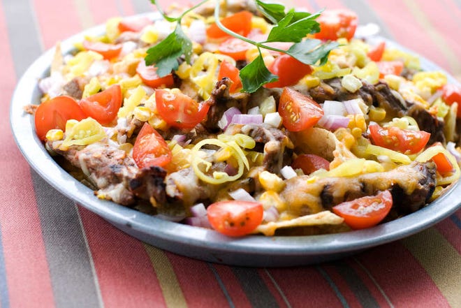 Preparing nachos on the grill takes more time than the microwave, but the difference in taste is worth the wait