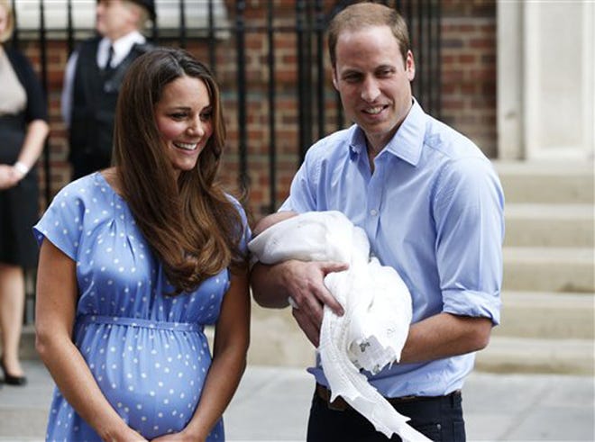 Britain's Prince William and Kate, Duchess of Cambridge hold the Prince of Cambridge, Tuesday July 23, 2013, as they pose for photographers outside St. Mary's Hospital exclusive Lindo Wing in London where the Duchess gave birth on Monday July 22. The Royal couple are expected to head to London’s Kensington Palace from the hospital with their newly born son, the third in line to the British throne.