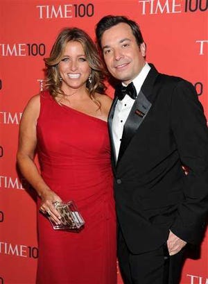 FILE - In this April 23, 2013 file photo shows talk show host Jimmy Fallon and his wife Nancy Juvonen at the TIME 100 Gala celebrating the "100 Most Influential People in the World" at Jazz at Lincoln Center in New York. A representative says Fallon and his wife, Nancy Juvonen Fallon, welcomed a baby daughter Tuesday, July 23. (Photo by Evan Agostini/Invision/AP, File)