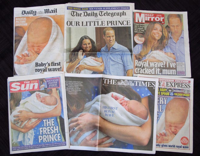A selection of British daily newspapers on Wednesday July 24, 2013 headlining the news of the birth of a son to Prince William and Kate, the Duke and Duchess of Cambridge. It was announced on Monday that Prince William's wife Kate has given birth to a baby boy. The baby was born at 4:24 p.m. and weighed 8 pounds 6 ounces. The infant will become third in line for the British throne after Prince Charles and William. (AP Photo/Tony Hicks)