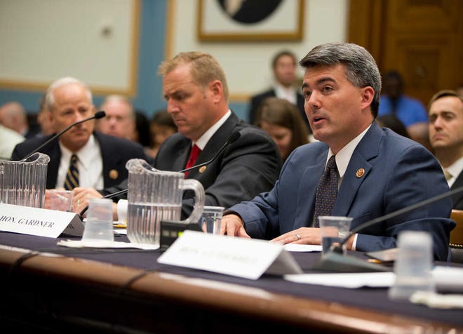Rep. Mike Coffman, R-Colo., left, and Rep. Jeff Denham, R-Calif., center, watch as Rep. Cory Gardner, D-Colo., testifies Tuesday on Capitol Hill before a House Judiciary subcommittee on immigration and border security hearing.