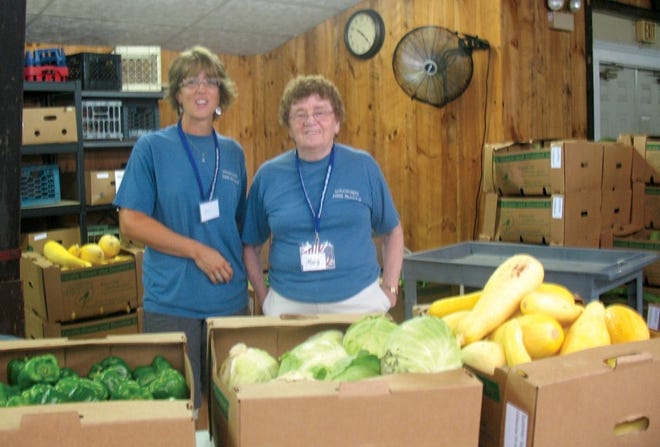 Wachusett Food Pantry volunteers at the new facility in the Cream Crock building, 50 Worcester Rd. (Rt. 12), Sterling. New equipment and lots of room makes for easy food distributions like the fresh produce shown here.