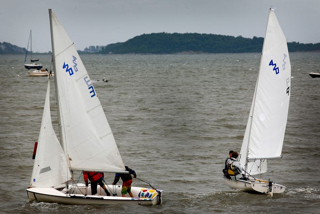 Rain, cold temperatures and high winds were a challenge for the young sailors competing in Quincy Bay Race Week, which started Thursday, July 25, 2013.