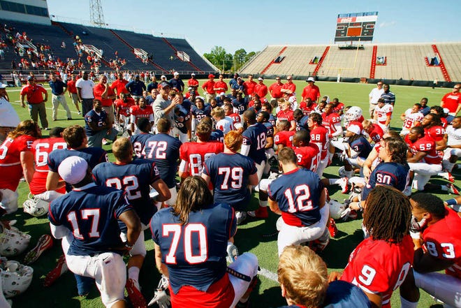 South Alabama head coach Joey Jones talks to his players following their spring game on March 24, 2012, at Ladd-Peebles Stadium in Mobile, Ala. South Alabama's fast track from no program to college football's top division has helped boost revenues and name recognition. (AP Photo/AL.com, John David Mercer) MAGS OUT