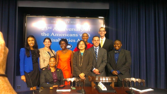 Anupa Iyer, left, Zoe Gross, Anjali Forber-Pratt, Desiree Moore, Lydia Brown, Associate Director of the White House Office of Public Engagement Claudia Gordon, Zachary Garafalo, Andrew Phillips, and Ki'tay Davidson at the White House. Gordon and others at the White House honored the eight people for their advocacy efforts and innovative projects to help people with disabilities.