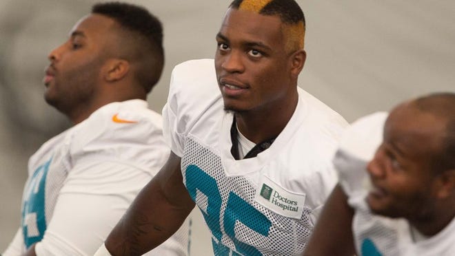 Miami Dolphins defensive end Dion Jordan (95) was initiated by veteran defensive players with a new hair style at Dolphins training camp day 3. (Allen Eyestone/The Palm Beach Post)