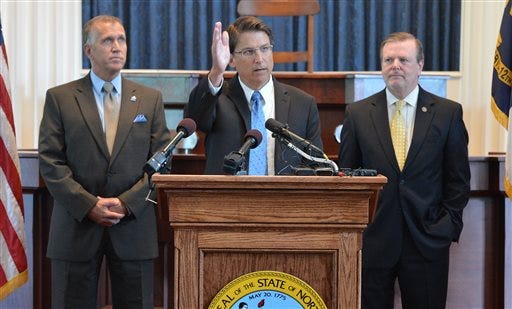 From left: Speaker of the House Thom Tillis, Gov. Pat McCrory, and President Pro Tempore of the Senate Phil Berger at a news conference to announce a tax plan Monday, July 15, 2013. (AP Photo/The News & Observer, Chuck Liddy)