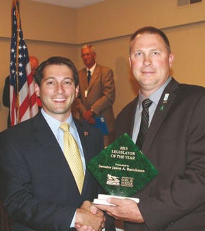 Senator Jason Barickman (R-Bloomington) is awarded the 2013 Legislator of the Year by the Association of Illinois Soil and Water Conservation Districts July 22 by Association President Lonnie E. Wilson.