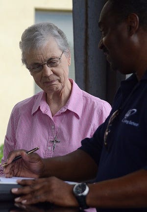 Sister Barbara Harrington, 78, who is living in retirement at the Grey Nun Academy in Yardley, takes the initial question-and-answer portion of driver skills assessment for drivers 55 and over with instructor Larry Gillette in the Yardley area Wednesday afternoon. The driving skills of about 50 nuns were evaluated.
