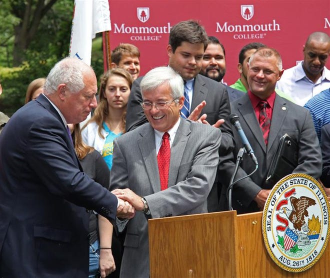 Monmouth College President Mauri Ditzler (middle) thanks
Gov. Pat Quinn for his support of capital funding to higher
education at Monday’s announcement ceremony in Rock Island.