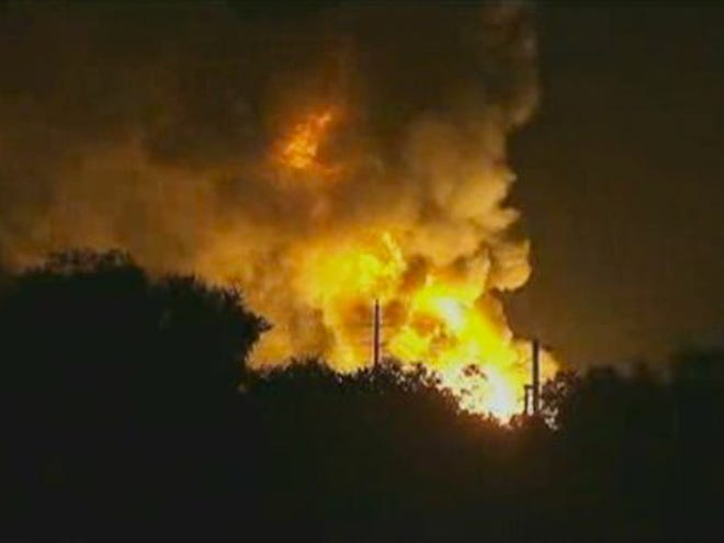 In this image taken from Associated Press video, flames rise from an explosion at the Blue Rhino propane plant in Tavares City, Fla., late Monday, July 29, 2013. John Herrell of the Lake County Sheriff's Office said early Tuesday that there were no fatalities despite massive blasts that ripped through the gas plant. Seven people were injured and transported to local hospitals. (AP Photo/AP video)