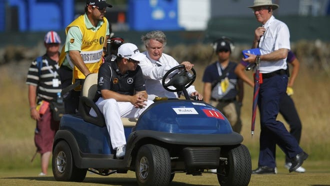 Louis Oosthuizen of Palm Beach Gardens is driven away after withdrawing during the first round of the British Open. (Brian Snyder/Reuters)