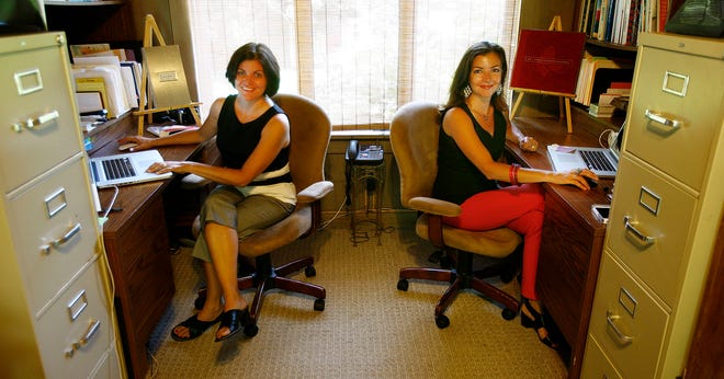Twin sisters Karyn Goba, left, and Christina Babin are partners in Pantano Creative of Hanover. The 10-year-old advertising and graphic design company is run from Karyn’s house.