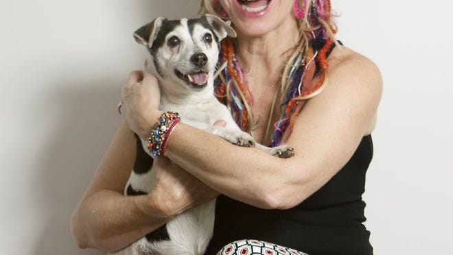 Sara Hickman with her dog, Lucky, at home in Austin. Hickman has just released a new collection of music called “Shine.”