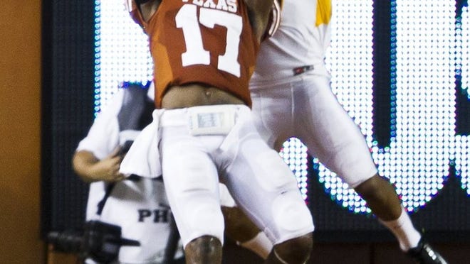 With so many star quarterbacks having left the Big 12, this season could be the Year of the Defensive Back, says Texas safety Adrian Phillips (17).