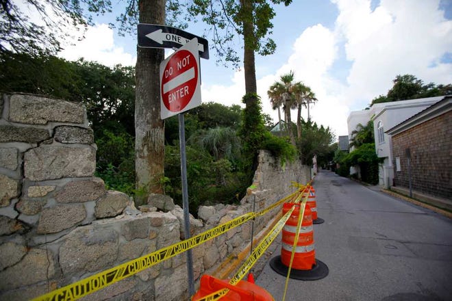 A portion of the coquina wall surrounfing the Oldest House Museum was knocked down after a tow truck driver inadvertently hit it on Tuesday morning, July, 30, 2013. By DARON DEAN, daron.dean@staugustine.com