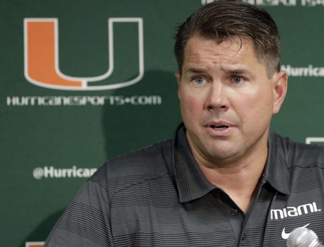 Miami head coach Al Golden talks to reporters during an NCAA college football news conference in Coral Gables, Fla., Thursday, Aug. 1, 2013. For the third straight year, Miami will have training camp with the anvil of an NCAA investigation hanging precariously over the program. The Hurricanes start practice Saturday, though Golden believes the end of the saga is finally near and that his team may actually have normalcy soon.