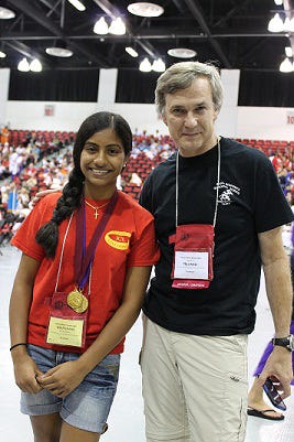 National champion MaryAnn Placheril with Geoff Revard, chairman of the Department of Modern and Classical Languages at Saint Stephen's Episcopal School.