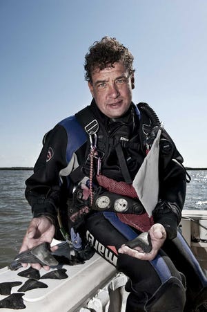 Submitted photo Local diver Bill Eberlein uncovers prehistoric Megalodon teeth in nearby rivers and waterways.