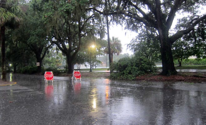 Eastbound Victory Drive north of Daffin Park was shut down due to water on the roadway Wednesday evening as heavy rains dropped on Savannah. (Dash Coleman/Savannah Morning News)
