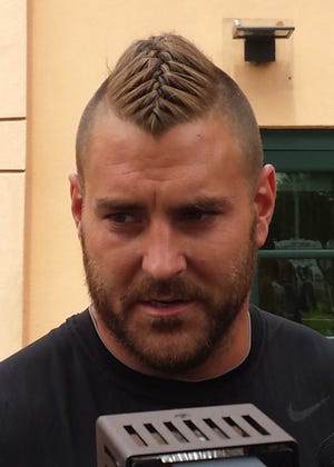 Eagles offensive lineman Todd Herremans, sporting a Viking-inspired, French-braided, Mohawk pony tail, moved out to right tackle on Thursday to help cover for some injured tackles.