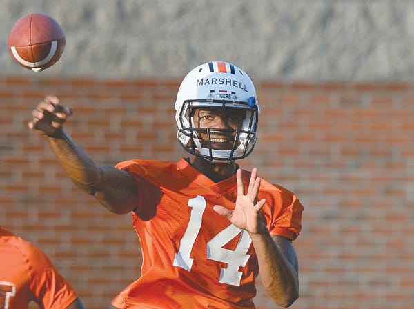 Auburn quarterback Nick Marshall throws a pass during practice Saturday in Auburn. (Todd Van Emst | Auburn University)