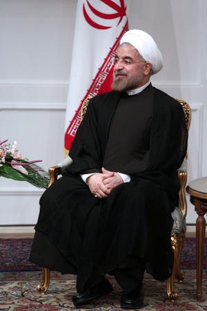 Iranian President Hasan Rouhani, sits in a meeting at the presidency office, in Tehran, Iran, Saturday, Aug. 3, 2013. Iran's supreme leader formally endorsed Hasan Rouhani as president Saturday, allowing the moderate cleric to take charge of a country weakened by economic sanctions over its nuclear program. (AP Photo/Ebrahim Noroozi)