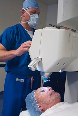 John Huff/Staff photographer

Dr. Richard Lasonde sets up the LenSx laser system for his patient Robert Nadeau at Northeast Surgical Care Center in Newington. LenSx is a revolutionary procedure for treating cataracts and restoring vision.