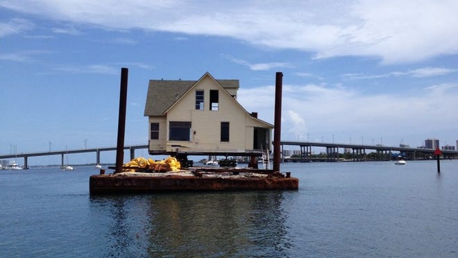 The Stambaugh cottage, which sits on a barge, is an ‘accident waiting to happen.’ Photo by Robert Holuba