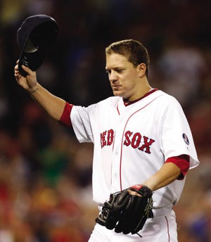 Boston Red Sox’s Jake Peavy tips his cap as he leaves in the eighth inning of Saturday’s game against the Arizona Diamondbacks. Peavy earned the win in his Red Sox debut.
