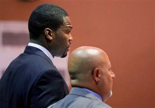 Rapper and actor Curtis Jackson appears with his attorney Scott Leemon during an arraignment at a Van Nuys Courthouse in Los Angeles on Monday, Aug 5, 2013. Jackson, also known as 50 Cent, has pleaded not guilty to domestic violence and vandalism charges involving an ex-girlfriend who is the mother of his child. (AP Photo/Nick Ut)