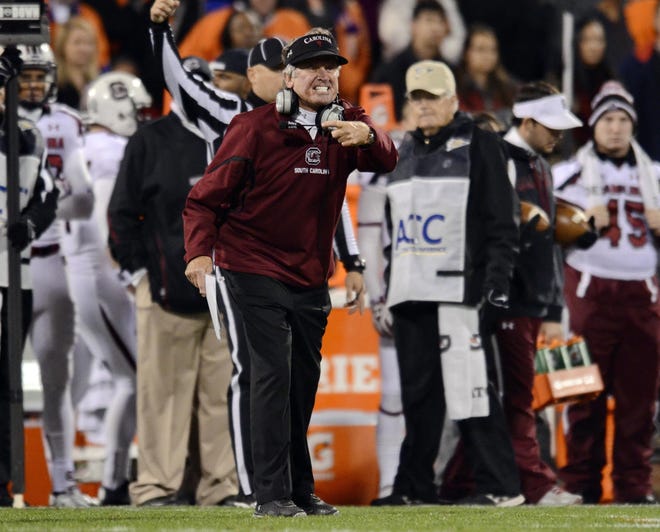 In this Nov. 24, 2012 file photo, South Carolina coach Steve Spurrier reacts during the first half of an NCAA college football game against Clemson at Memorial Stadium in Clemson, S.C.