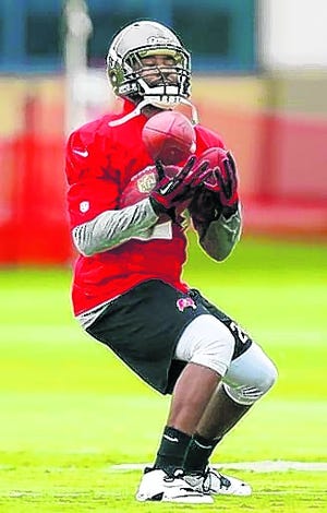 Bucs CB Darrelle Revis practices during training camp Thursday in Tampa. The 
Bucs shut down Revis after four straight practices.ASSOCIATED PRESS