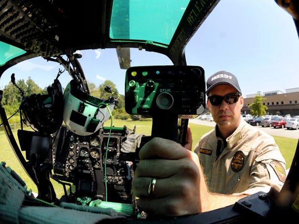 Chris Grindstaff regularly operates the helicopter's infrared camera system. Southeastern North Carolina Airborne Law Enforcement, commonly called SABLE, includes this former military Bell OH-58C Kiowa helicopter manufactured in 1968, as one of two units available for emergency response.