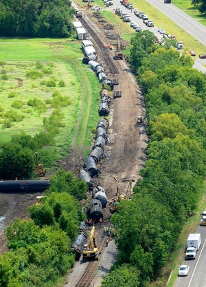 Crews work to repair about 1,800 feet of Union Pacific track Monday after a 
train with 76 cars derailed Sunday just east of Lawtell, La., forcing the 
evacuation of about 100 homes.AP PHOTO / BRYAN TUCK