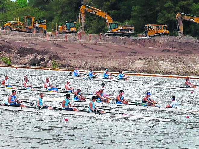 Teams participate in the state high school rowing championships last year at 
Nathan Benderson Park, while heavy machinery on shore signifies renovations 
still under way.HERALD-TRIBUNE ARCHIVE