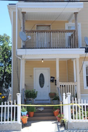 The house at 30 Fuller St. in Brockton, seen on Tuesday, August 6, 2013, where Charles E. Springer, 34, of Brockton, was shot and killed in Apt. 1 on Monday night.