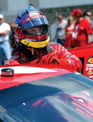 Juan Pablo Montoya climbs out of his car after taking pole position for last year's NASCAR Sprint Cup Series race at Watkins Glen International.
