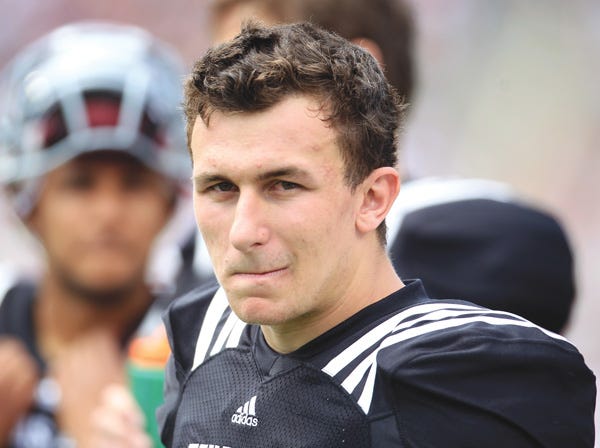 Texas A&M's Johnny Manziel reportedly is under investigation by the NCAA for profiting off autographs he signed. (Karen Warren | Houston Chronicle | Associated Press | File)
