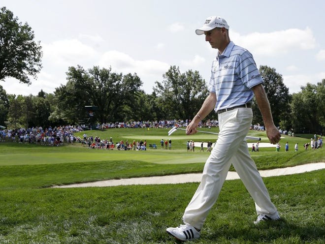 Adam Scott walks to the 15th green during the first round of the PGA Championship.
(AP PHOTO)
