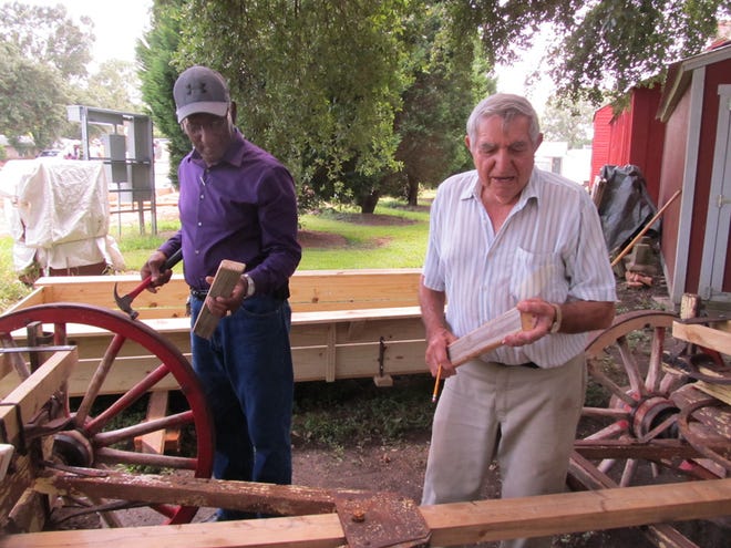 Volunteer Harvey Hill and museum custodian Kirby Guerin have restored the old wagon.