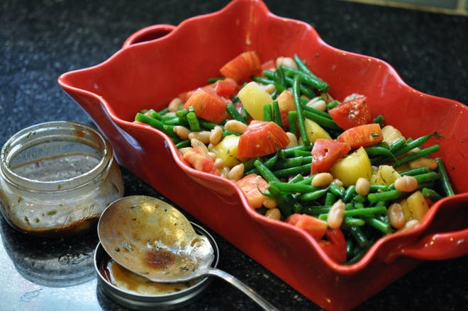 A salad of steamed, then cooled, French beans, white beans and mixed heirloom tomatoes is dressed in a balsamic vinaigrette that includes tarragon and Dijon mustard.
