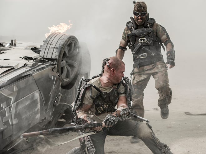 Matt Damon as Max, left, and Sharlto Copley as Kruger, battle in “Elysium.”