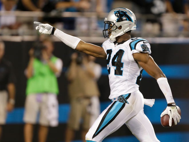 Carolina's Josh Norman celebrates after returning an interception for a touchdown against the Chicago Bears in preseason action on Friday night in Charlotte, N.C.