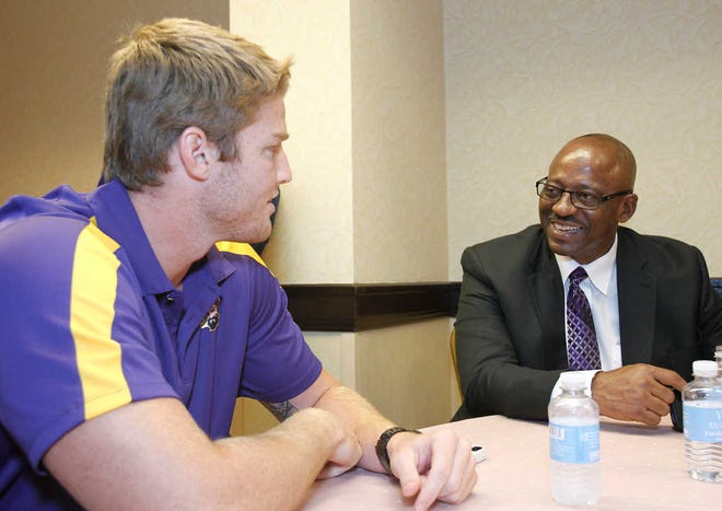 East Carolina quarterback Shane Carden speaks coach Ruffin McNeill at the NCAA college Conference USA football media day Wednesday, July 24, 2013 in Irving, Texas. (AP Photo/Tim Sharp)