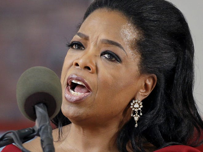 In this May 30, 2013 file photo, Oprah Winfrey speaks during Harvard University's commencement ceremonies in Cambridge, Mass. Winfrey says she had a racist encounter while shopping in Switzerland _ and the apologetic national tourist office agrees. The billionaire media mogul told the U.S. program â€œEntertainment Tonightâ€ that a shop assistant in Zurich refused to show her black handbag because it was â€œtoo expensiveâ€ for her. She was in town to attend last monthâ€™s wedding of her longtime pal Tina Turner, who lives in a Swiss chateau along Lake Zurich. Forbes magazine estimates that Winfrey earned $77 million in the year ending in June. (AP Photo/Elise Amendola, File)