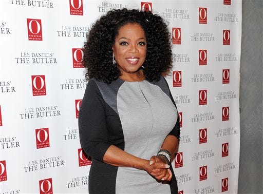 FILE - This July 31, 2013 file photo shows media mogul and actress Oprah Winfrey at a special screening of "Lee Daniels' The Butler" New York. Winfrey says she ran into Swiss racism when a clerk at Trois Pommes, a pricey Zurich boutique, refused to show her a black handbag, telling one of the world's richest women that she "will not be able to afford" the $38,000 price tag. Winfrey earned $77 million in the year ending in June, according to Forbes magazine. (Photo by Evan Agostini/Invision/AP, File)