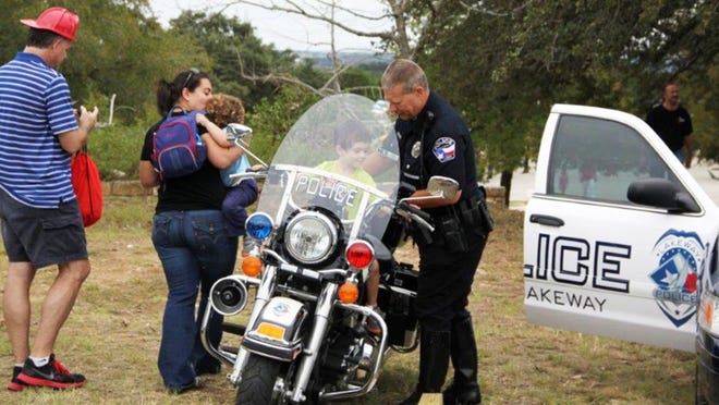 Officer Steve Adams of the Lakeway Police Department introduces crowds of all ages to a department motorcycle at Lakeway Public Safety Day in 2012. This year’s event is scheduled from 9 a.m. to 4 p.m. Sept. 7 at Lake Travis Educational Development Center.